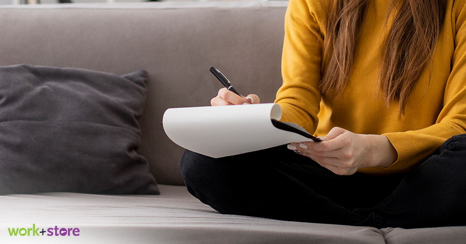 girl creating a list for her self storage unit