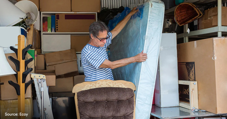 man organizing self storage vertically