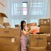 Girl packing her things in self storage