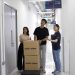 Young adults using flexible storage units at Work and Store facility