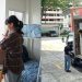 Student packing and movers loading a truck.