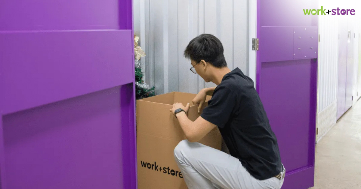 Customer organizing items in a self storage unit.