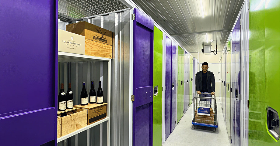 Man moving a wine collection at Work+Store storage facility.