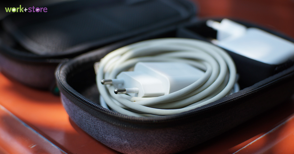 Various universal travel power adapters on a travel pouch.