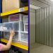 Woman organizing inventory containers.